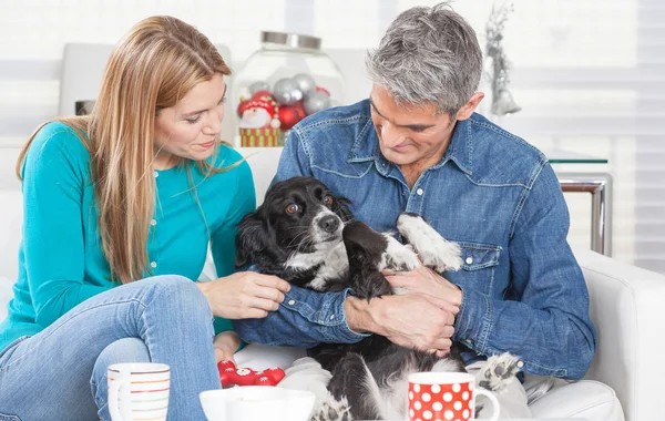 wife and husband with dog at home