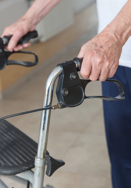 Man with walker in hospital, hands detail — Stock Photo, Image