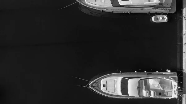 Overhead aerial view of anchored boats in a small port