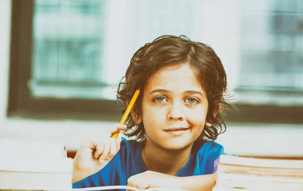 Boy at school thinking — Stock Photo, Image