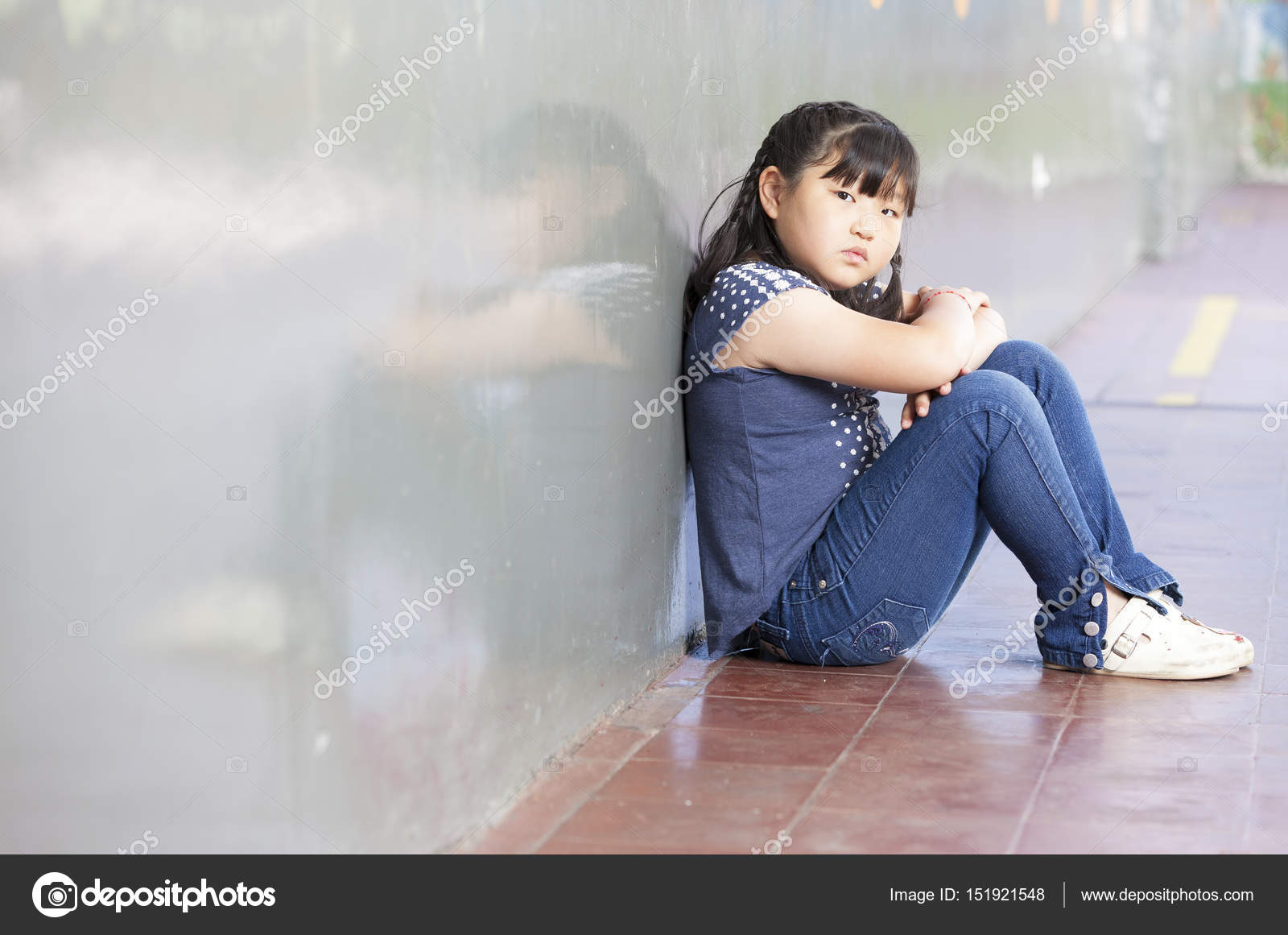 Asian Schoolgirl Alone In A School Corner Bullying Concept Stock Photo Asian Schoolgirl Alone In A School Corner Bullying Concept Stock Photo