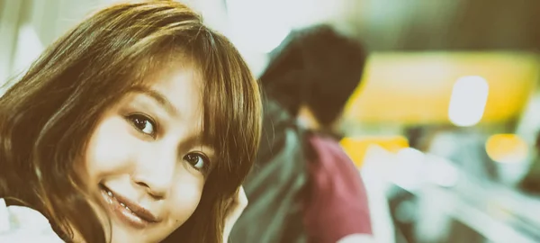 Happy asian girl in subway escalator — Stock Photo, Image