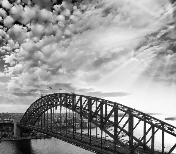 Black and white sunset aerial view of Sydney Harbour Bridge, NSW