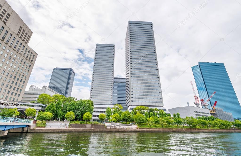 Osaka skyline along city river