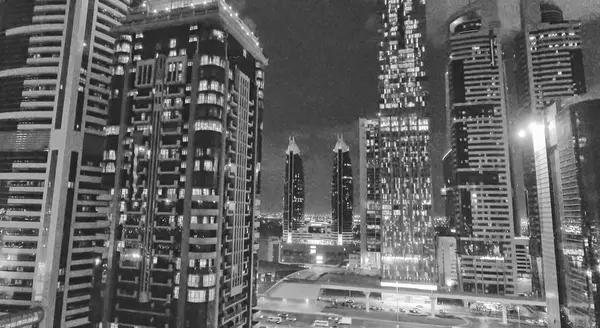 Downtown Dubai ve Sheikh Zayed Road gece havadan görünümü