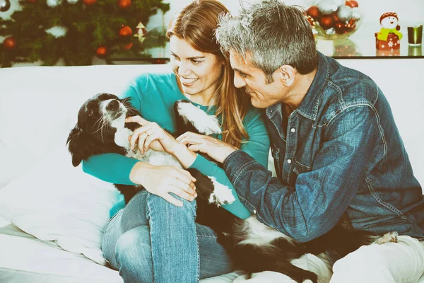 wife and husband with dog at home