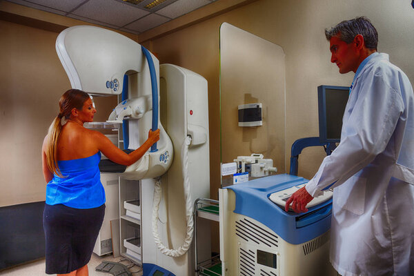 Female patient near mammography machine