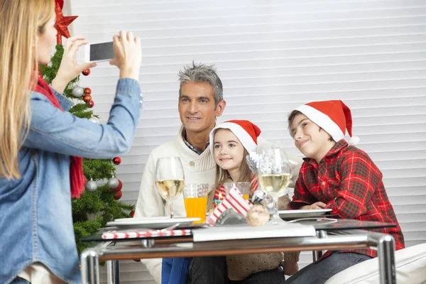 Mother making picture to the rest of family at home for Christma — Stock Photo, Image