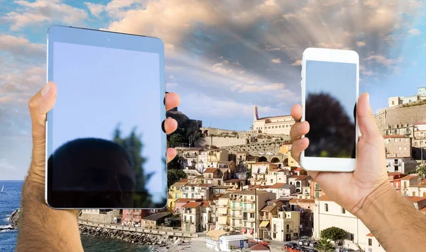 Smartphone and tablet taking pictures of Mediterranean town skyl — Stock Photo, Image
