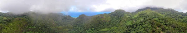 Aerial panoramic view of beautiful tropical mountains shrouded b — Stock Photo, Image