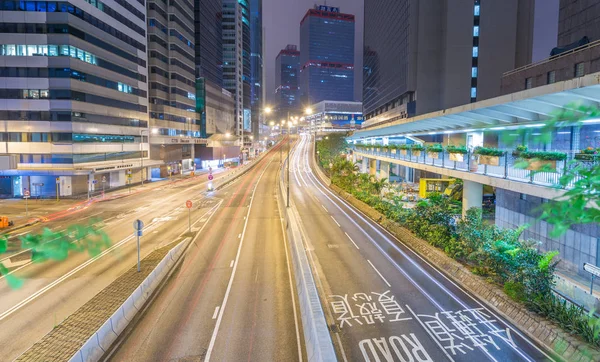 HONG KONG - MAY 12, 2014: Modern city skyline with road car ligh — Stock Photo, Image