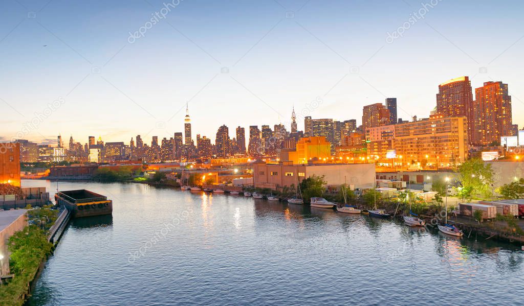 Midtown Manhattan and East River at sunset, New York City.