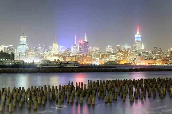 Downtown Manhattan at night as seen from Jersey City.