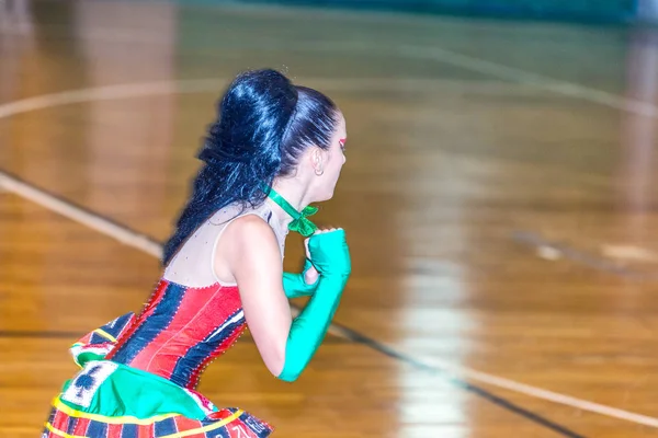 Girl skating on the roller skate rink.