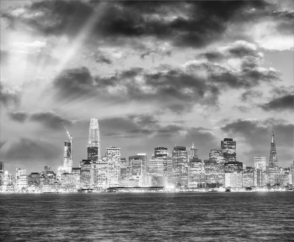 San Francisco city skyline with sea reflections at night.