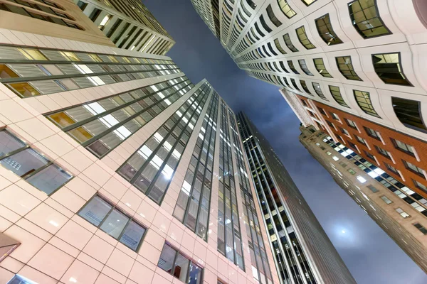 Night lights of city buildings as seen from the street — Stock Photo, Image