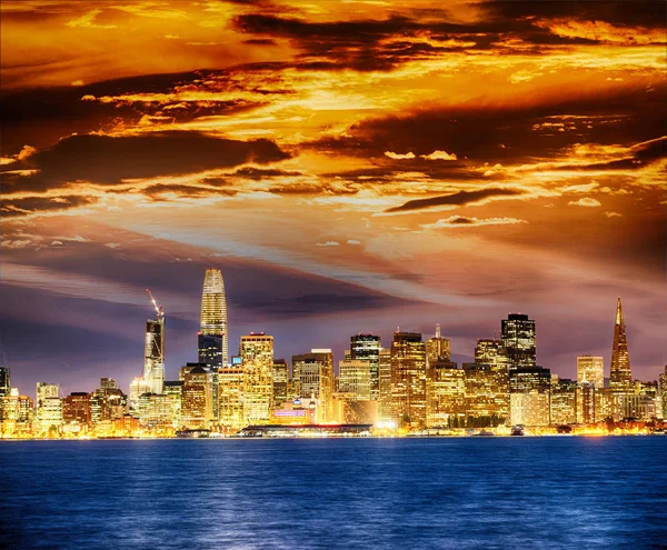 San Francisco city skyline with sea reflections at night.