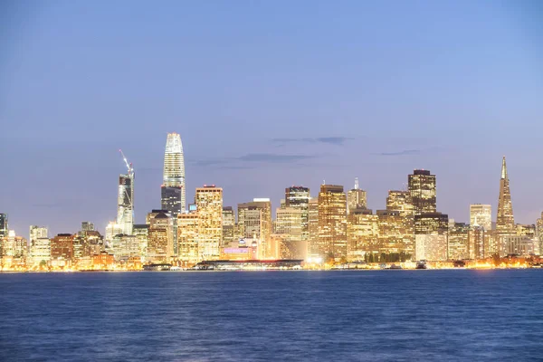 San Francisco city skyline with sea reflections at night.