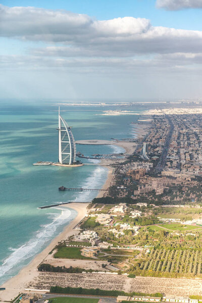 Amazing aerial Dubai skyline from helicopter. Cityscape and coastline.