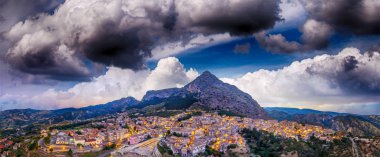 Stilo panoramic aerial view at summer sunset, medieval town on top a Calabria hill, Italy. clipart