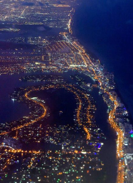 Miami Beach lights at night from departing aircraft.