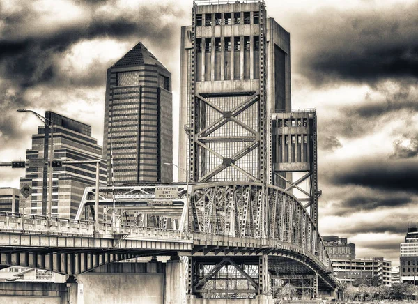 Jacksonville skyline with bridge and buildings on a overcast day.