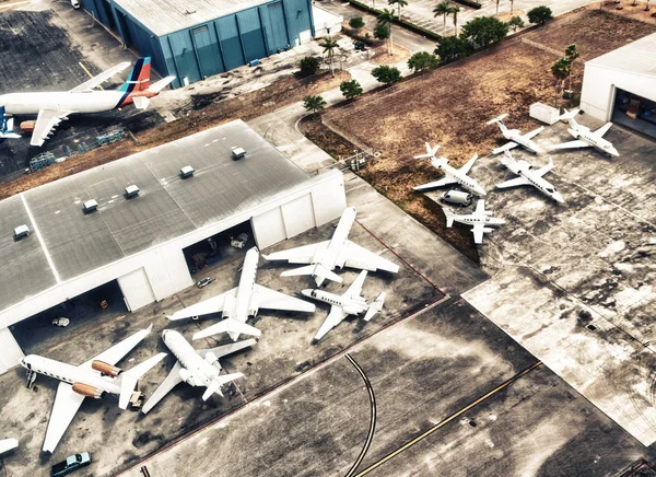 Airplanes docked at the airport, aerial view.