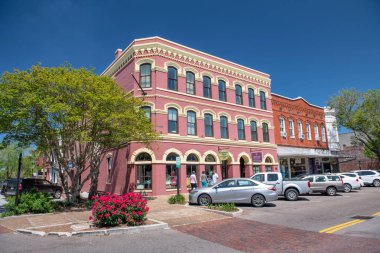 AMELIA ISLAND, FL - APRIL 1, 2018: Beautiful old buildings on a sunny day. Amelia Island is a major Florida attraction for tourists. clipart