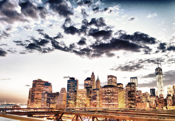 Manhattan at sunset from Brooklyn Bridge.
