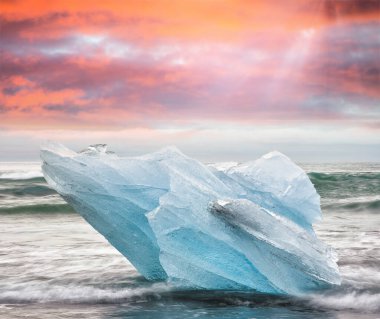 Blurred long exposure view of Icebergs moving in Jokulsarlon Lag clipart