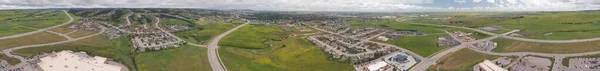 Aerial view of small town and surrounding landscape in summer se — Stock Photo, Image