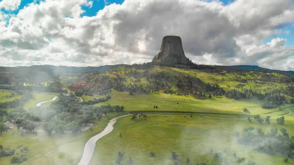 Aerial view of Devils Tower National Monument at summer sunset,