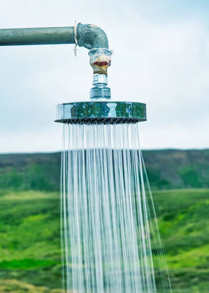 Close up of shower in open air countryside — Stockfoto