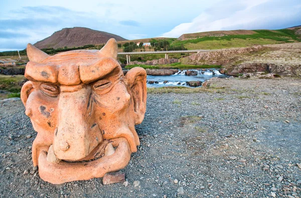 Troll sculpture near the waterfalls, Iceland — Stock Photo, Image