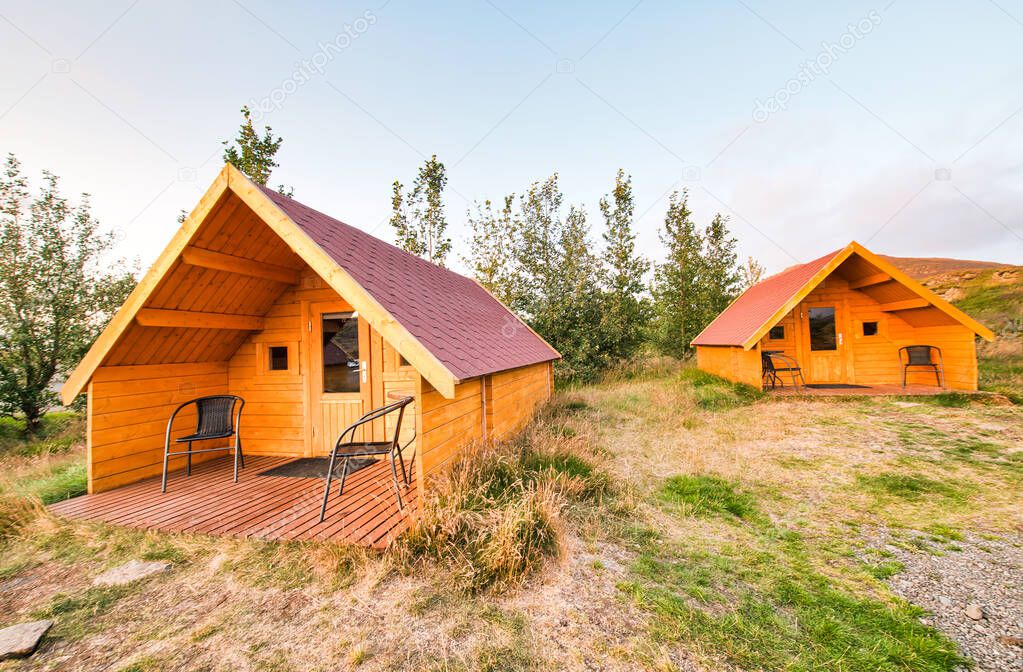 Wooden homes at forest border. Holiday and relax concept