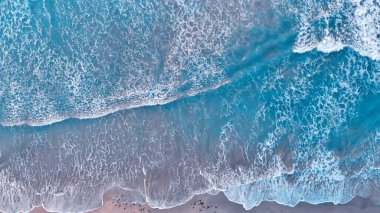 Aerial looking straight down onto large swell and waves. Overhea clipart