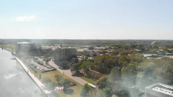 Savannah, Georgia, USA. Aerial view of city ad river on a sunny