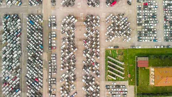 Aerial overhead view of Cars For Sale Stock Lot Row. Car Dealer Inventory