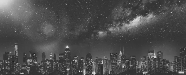 Panoramic night skyline of Midtown Manhattan on a starry night,