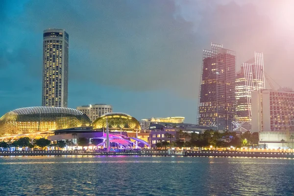 Singapore night skyline. Buildings along Marina Bay area