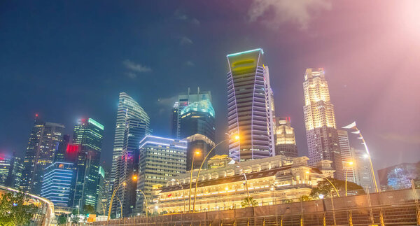 Singapore night skyline. Buildings along Marina Bay area.