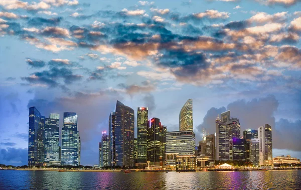 Singapore night skyline. Buildings along Marina Bay area