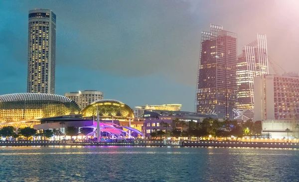 Singapore night skyline. Buildings along Marina Bay area