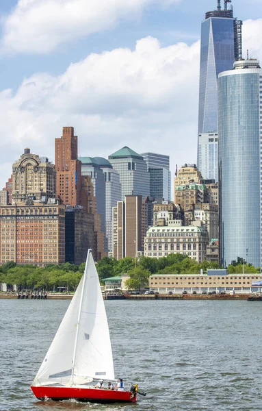 Sailing boat in front of Lower Manhattan, New York City. Holiday and travel concept.
