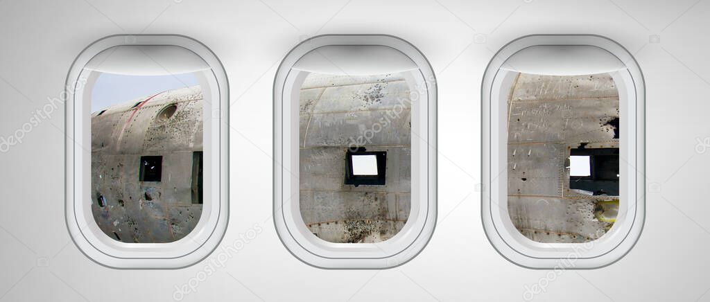 Airplane windows with aircraft wreckage view. Travel and holiday abstract concept.