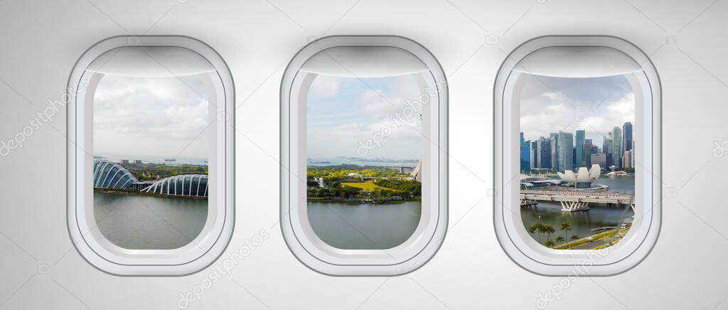 Airplane windows with Singapore skyline view. Travel and holiday abstract concept.