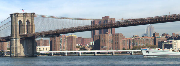 Brooklyn Bridge and Manhattan skyscrapers and buildings, New York City, USA.