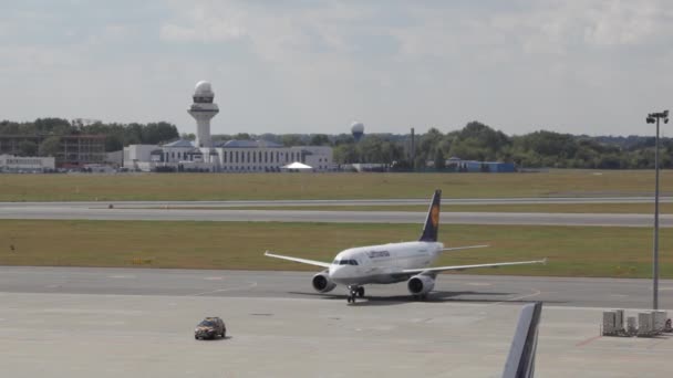 Commercial plane prepare to take off at airport, takeoff aircraft with Chopin Airport. Warsaw Airport, Plane stands in airport, territory near control office, — Stock Video