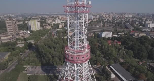 Aerial TV tower. TV tower in Kiev Close to residential buildings and highway.Digital television broadcasting and surveillance Tower restaurant city skyline Kiev, Ukraine. Summer sunny day. — Stock Video