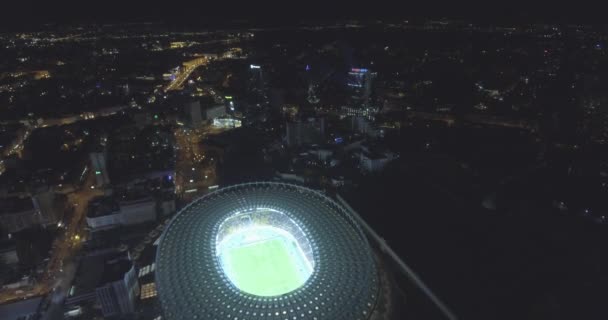 Aerial survey. Kiev-Olympic Stadium October 9, 2017. World Cup. Ukraine-Croatia. cityscape time of day night. The view from the top to the illuminated stadium with games and fans. — Stock Video